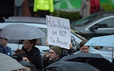 People gather for a vigil in Squirrel Hill, Pennsylvania on October 27, 2018, to remember those that died in the Tree of Life Synagogue shooting earlier in the day. (Dustin Franz / AFP)