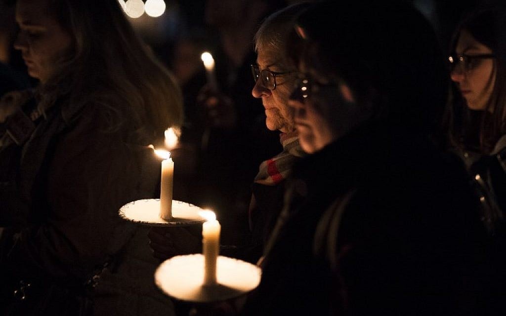 Members and supporters of the Jewish community come together for a candlelight vigil, in remembrance of those who died earlier in the day during a shooting at the Tree of Life Synagogue in the Squirrel Hill neighborhood of Pittsburgh, in front of the White House in Washington, DC on October 27, 2018. (Photo by ANDREW CABALLERO-REYNOLDS / AFP)