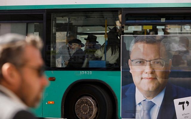 A picture taken on October 28, 2018, shows a campaign poster of municipal candidate Moshe Lion on a bus ahead of the upcoming Jerusalem municipal elections, in Jerusalem. (MENAHEM KAHANA / AFP)
