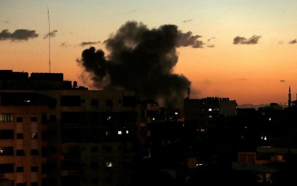 Illustrative: A picture taken on on October 27, 2018, shows smoke rising following an Israeli airstrike in Gaza City. (Mahmud Hams/AFP)