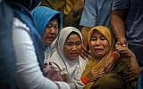 Family members of the crashed Indonesian Lion Air JT-610 react at Pangkal Pinang airport, in Bangka Belitung province on October 29, 2018. (HADI SUTRISNO / AFP)