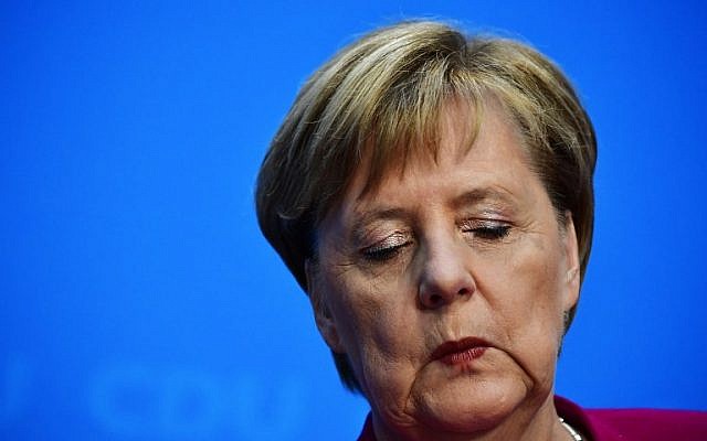 German Chancellor and leader of the Christian Democratic Union (CDU) Angela Merkel closes her eyes during a press conference at the CDU headquarters on October 29, 2018 in Berlin. Merkel announced she will not stand again as leader of her centre-right CDU, which she has chaired the CDU for 18 years, and will step down as German chancellor when her mandate ends in 2021. (Tobias SCHWARZ / AFP) German Chancellor and leader of the Christian Democratic Union (CDU) Angela Merkel closes her eyes during a press conference at the CDU headquarters on October 29, 2018 in Berlin. Merkel announced she will not stand again as leader of her centre-right CDU, which she has chaired the CDU for 18 years, and will step down as German chancellor when her mandate ends in 2021. (Tobias SCHWARZ / AFP)