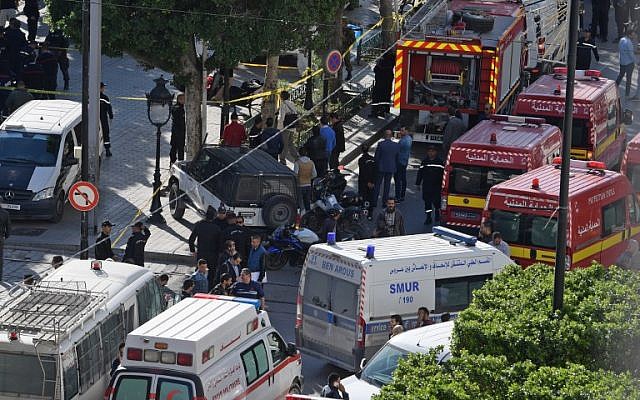 A picture taken on October 29, 2018, shows police and firemen gathering at the site of a suicide attack in the center of the Tunisian capital Tunis. (Photo by FETHI BELAID / AFP) A picture taken on October 29, 2018, shows police and firemen gathering at the site of a suicide attack in the center of the Tunisian capital Tunis. (Photo by FETHI BELAID / AFP)