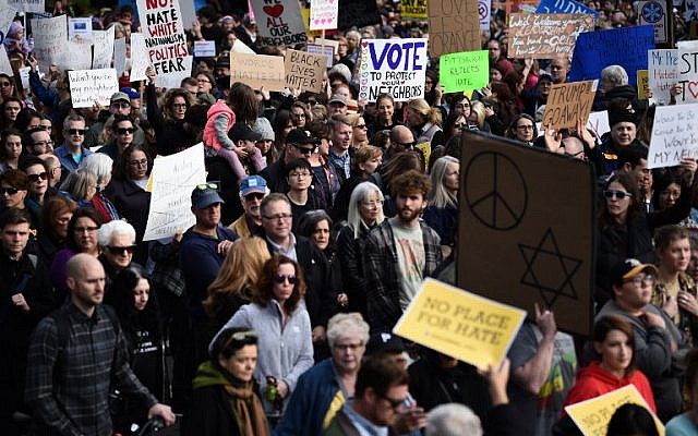 People protest the arrival of US President Donald Trump as he visits the Tree of Life Congregation on October 30, 2018 in Pittsburgh, Pennsylvania. (Photo by Brendan SMIALOWSKI / AFP) People protest the arrival of US President Donald Trump as he visits the Tree of Life Congregation on October 30, 2018 in Pittsburgh, Pennsylvania. (Photo by Brendan SMIALOWSKI / AFP)