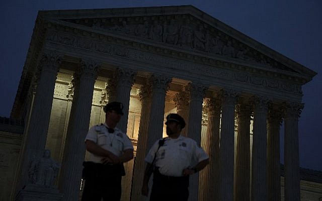 Police officers stand guard in front of the US Supreme Court October 5, 2018 in Washington, DC. (Alex Wong/Getty Images/AFP)