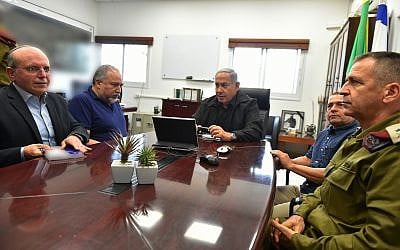 From L to R: National Security Adviser Meir Ben-Shabbat, Prime Minister Benjamin Netanyahu, Defense Minister Avigdor Liberman, Shin Bet chief Nadav Argaman and IDF Deputy Chief of Staff Aviv Kochavi hold a situational assessment near the Gaza border on October 17, 2018. (Ariel Hermoni/Ministry of Defense)
