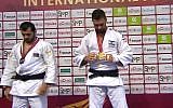 Screen capture from video of Israeli judoka Peter Paltchik, right, who taking a gold medal in the under 100 kilogram category at the International Judo Federation Grand Prix in Abu Dhabi, October 29, 2018. (International Judo Federation)
