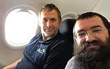 Rabbi Zalmen Wishedski, right, wrote a Facebook post about his conversation with a German man who travels to Israel to renovate Holocaust survivors’ apartments. (Wishedski/JTA)