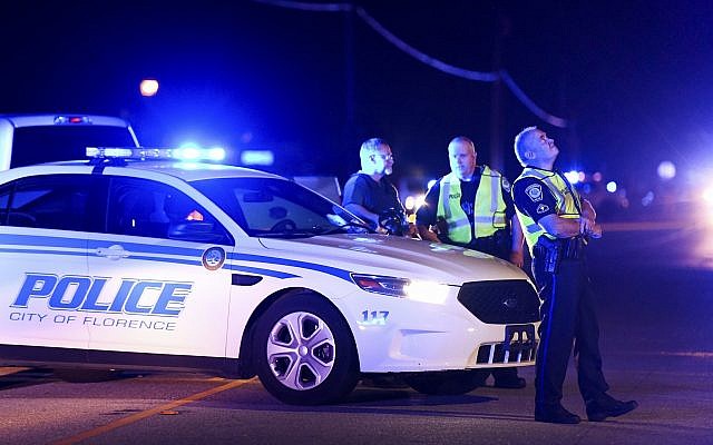 Authorities direct traffic on Hoffmeyer Road near the Vintage Place neighborhood where several law enforcement officers were shot, one fatally, Wednesday, Oct. 3, 2018, in Florence, S.C. (AP Photo/Sean Rayford) Authorities direct traffic on Hoffmeyer Road near the Vintage Place neighborhood where several law enforcement officers were shot, one fatally, Wednesday, Oct. 3, 2018, in Florence, S.C. (AP Photo/Sean Rayford)