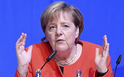 German Chancellor and chairwomen of the Christian Democratic Party (CDU), Angela Merkel, answers questions of delegates during a convention of the party´s youth section in Kiel, Germany, October 6, 2018. (Carsten Rehder/dpa via AP)