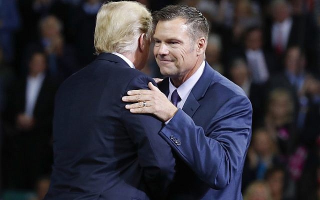 US President Donald Trump, left, on stage with Republican gubernatorial candidate Secretary of State Kris Kobach, right, during a campaign rally at Kansas Expocentre, October 6, 2018 in Topeka, Kansas. (AP Photo/Pablo Martinez Monsivais) US President Donald Trump, left, on stage with Republican gubernatorial candidate Secretary of State Kris Kobach, right, during a campaign rally at Kansas Expocentre, October 6, 2018 in Topeka, Kansas. (AP Photo/Pablo Martinez Monsivais)
