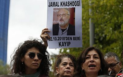 Activists and members of the Human Rights Association Istanbul branch hold posters with photos of missing Saudi journalist Jamal Khashoggi and talk to members of the media, during a protest in his support near the Saudi Arabia consulate in Istanbul, October 9, 2018. (AP Photo/Lefteris Pitarakis)