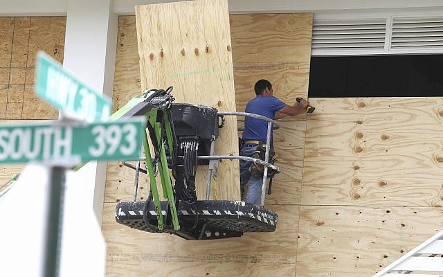 Workers finish boarding up the upper level of Shunk Gulley Oyster Bar at Gulf Place on Tues. Oct. 9, 2018 in Santa Rosa Beach, Fla., ahead of Hurricane Michael's possible landfall in the next 24 hours in South Walton County. (Michael Snyder/Northwest Florida Daily News via AP) Workers finish boarding up the upper level of Shunk Gulley Oyster Bar at Gulf Place on Tues. Oct. 9, 2018 in Santa Rosa Beach, Fla., ahead of Hurricane Michael's possible landfall in the next 24 hours in South Walton County. (Michael Snyder/Northwest Florida Daily News via AP)