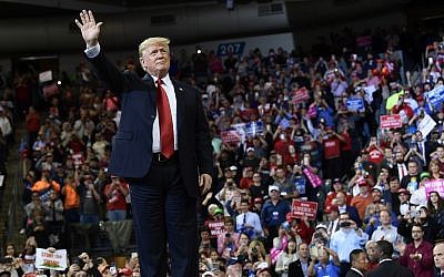 President Donald Trump arrives to speak at a rally in Council Bluffs, Iowa, Tuesday, Oct. 9, 2018. (AP Photo/Susan Walsh)