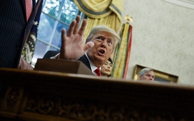 President Donald Trump talks with reporters during a signing ceremony for the "Save Our Seas Act of 2018" in the Oval Office of the White House on October 11, 2018, in Washington. (AP/Evan Vucci) President Donald Trump talks with reporters during a signing ceremony for the "Save Our Seas Act of 2018" in the Oval Office of the White House on October 11, 2018, in Washington. (AP/Evan Vucci)