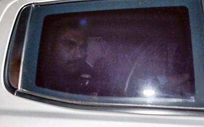 US pastor Andrew Brunson, center, sits inside a car as he arrives for his trial in Izmir, Turkey, early Friday, Oct. 12, 2018.(AP Photo/Emrah Gurel)