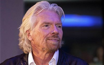 British billionaire Richard Branson visits a Zumba Step dance class at Virgin installations in Madrid, Spain, December 10, 2003. (AP Photo/Abraham Caro Marin, file)