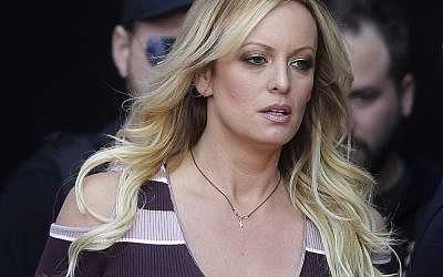 In this Thursday, Oct. 11, 2018, file photo, adult film actress Stormy Daniels arrives for the opening of the adult entertainment fair "Venus," in Berlin. On Monday, Oct. 15, 2018, a federal judge dismissed Daniels' defamation lawsuit against President Donald Trump. (AP Photo/Markus Schreiber, File)