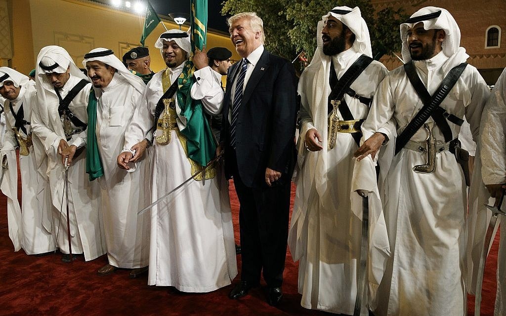 In this photo from May 20, 2017, US President Donald Trump holds a sword and dances with traditional dancers during a welcome ceremony at Murabba Palace, in Riyadh, Saudi Arabia. (AP Photo/Evan Vucci, File) In this photo from May 20, 2017, US President Donald Trump holds a sword and dances with traditional dancers during a welcome ceremony at Murabba Palace, in Riyadh, Saudi Arabia. (AP Photo/Evan Vucci, File)