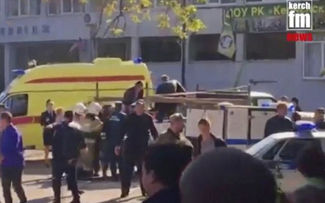 This image made from video shows the scene as emergency services load an injured person onto a truck, in Kerch, Crimea, Wednesday Oct. 17, 2018. (Kerch FM News via AP) This image made from video shows the scene as emergency services load an injured person onto a truck, in Kerch, Crimea, Wednesday Oct. 17, 2018. (Kerch FM News via AP)