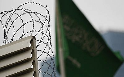 Behind barbed wire, Saudi Arabia's flag flies atop the country's consulate in Istanbul, October 18, 2018 (AP Photo/Lefteris Pitarakis)