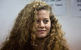 In this Tuesday, February 13, 2018 file photo, Palestinian activist Ahed Tamimi stands inside the Ofer military prison near Jerusalem. (AP Photo/Ariel Schalit, File)