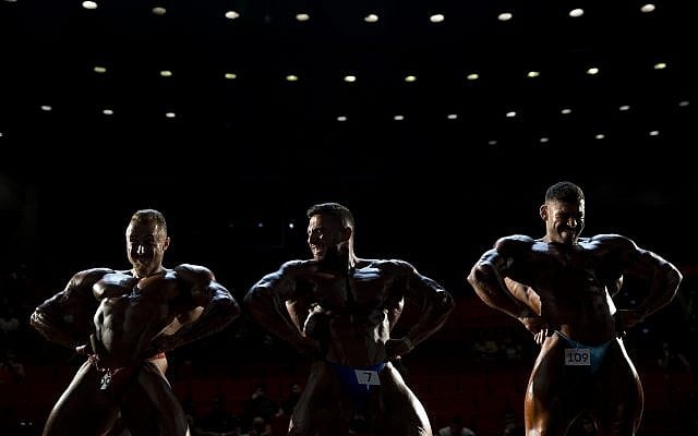 Contestants participate in the final round during the National Amateur Body Builders' Association competition in Tel Aviv, Israel, Thursday, October 18, 2018. (Oded Balilty/AP)