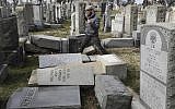 Rabbi Joshua Bolton of the University of Pennsylvania's Hillel center surveys damaged headstones at Mount Carmel Cemetery in Philadelphia, on February 27, 2017. (AP Photo/Jacqueline Larma, File)