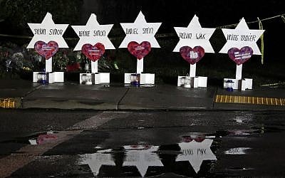 Stars of David with names of those killed in a shooting at the Tree of Life Synagogue in Pittsburgh, at a memorial outside the synagogue, Sunday, Oct. 28, 2018. (AP Photo/Gene J. Puskar)