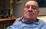 In this October 29, 2018 photo, Holocaust survivor Judah Samet, 80, sits in his living room in Pittsburgh. (AP Photo/Allen G. Breed)