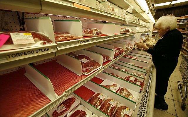 Illustrative: A customer shops at a kosher butcher shop in North Miami Beach, Florida, on Nov. 25, 2008. (AP Photo/Wilfredo Lee) Illustrative: A customer shops at a kosher butcher shop in North Miami Beach, Florida, on Nov. 25, 2008. (AP Photo/Wilfredo Lee)