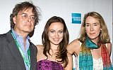 Actress Olivia Wilde and her parents, producer Andrew Cockburn and director Leslie Cockburn, arrive at the premiere of American Casino during the Tribeca Film Festival in New York, Sunday, April 26, 2009. (AP Photo/Charles Sykes)
