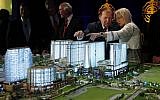 Sheldon Adelson and Miriam Adelson look at a model of the Sands Cotai Central resort during a news conference in Macau on April 12, 2012. (AP /Kin Cheung)