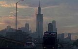 Illustrative: Early commuters drive as the sun rises over the Chicago skyline Friday, June 30, 2017. (AP Photo/G-Jun Yam)