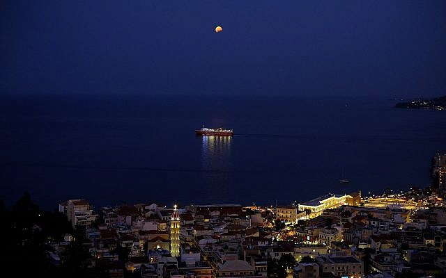 The moon in seen in a partial lunar eclipse over a ship in Zakynthos island on Monday, Aug. 7, 2017. (AP/Petros Karadjias) The moon in seen in a partial lunar eclipse over a ship in Zakynthos island on Monday, Aug. 7, 2017. (AP/Petros Karadjias)