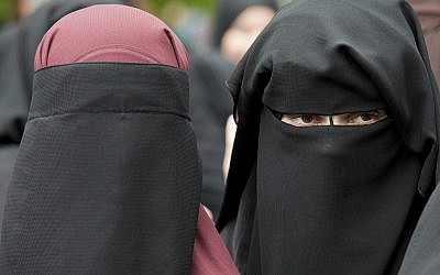 Illustrative: In this photo from June 28, 2014, veiled women attend a speech by preacher Pierre Vogel, in Offenbach, near Frankfurt, Germany. (Boris Roessler/dpa via AP,file)