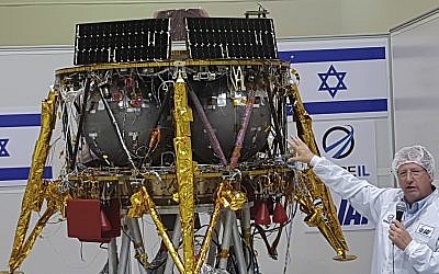 Opher Doron, general manager of Israel Aerospace Industries' space division, speaks beside the SpaceIL lunar module, in a special "clean room" where the space craft is being developed, during a press tour of their facility near Tel Aviv, Israel, July 10, 2018. (AP Photo/Ilan Ben Zion)