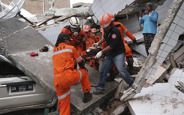 People survey the damage of the shopping mall following earthquakes and a tsunami in Palu, Central Sulawesi, Indonesia, on September 30, 2018. (AP Photo/Tatan Syuflana) People survey the damage of the shopping mall following earthquakes and a tsunami in Palu, Central Sulawesi, Indonesia, on September 30, 2018. (AP Photo/Tatan Syuflana)