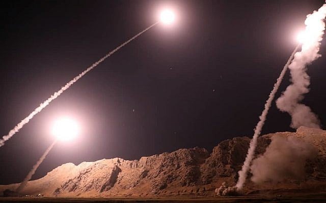 In this photo released on October 1, 2018, by the Iranian Revolutionary Guard, missiles are fired from city of Kermanshah in western Iran targeting the Islamic State group in Syria (Sepahnews via AP)