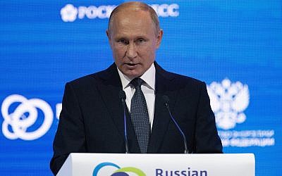 Russian President Vladimir Putin speaks at the Russian Energy Week International Forum in Moscow, Russia, October 3, 2018. (AP Photo/Alexander Zemlianichenko, Pool)