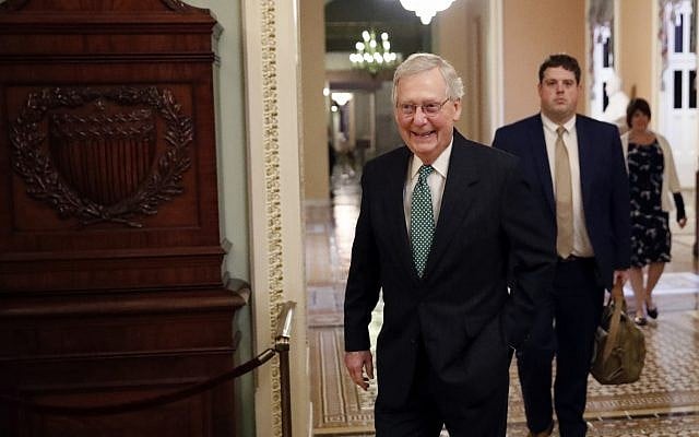 Senate Majority Leader Mitch McConnell of Ky., left, walks out of his office on Capitol Hill, Wednesday, Oct. 3, 2018 in Washington. (AP Photo/Alex Brandon) Senate Majority Leader Mitch McConnell of Ky., left, walks out of his office on Capitol Hill, Wednesday, Oct. 3, 2018 in Washington. (AP Photo/Alex Brandon)