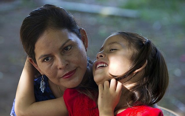 Araceli Ramos holds her 5-year-old daughter, Alexa, on her lap during an interview in a park in San Miguel, El Salvador, on August 18, 2018. (AP Photo/Rebecca Blackwell) Araceli Ramos holds her 5-year-old daughter, Alexa, on her lap during an interview in a park in San Miguel, El Salvador, on August 18, 2018. (AP Photo/Rebecca Blackwell)