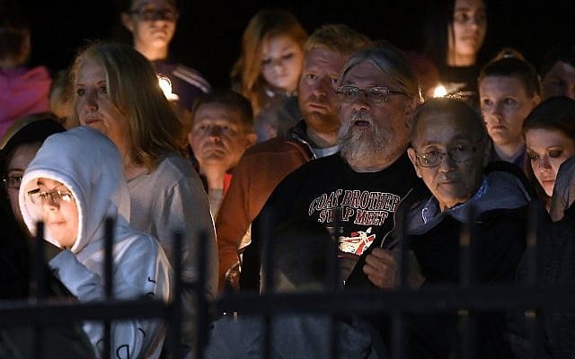 Family members and friends gather for a candlelight vigil memorial at Mohawk Valley Gateway Overlook Pedestrian Bridge in Amsterdam, N.Y., Monday, Oct. 8, 2018. The memorial honored 20 people who died in Saturday's fatal limousine crash in Schoharie, N.Y., (AP Photo/Hans Pennink) Family members and friends gather for a candlelight vigil memorial at Mohawk Valley Gateway Overlook Pedestrian Bridge in Amsterdam, N.Y., Monday, Oct. 8, 2018. The memorial honored 20 people who died in Saturday's fatal limousine crash in Schoharie, N.Y., (AP Photo/Hans Pennink)