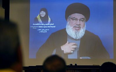 Hezbollah leader Hassan Nasrallah speaks via a video link, in Beirut, Lebanon, Friday, October 12, 2018 (AP Photo/Hussein Malla)