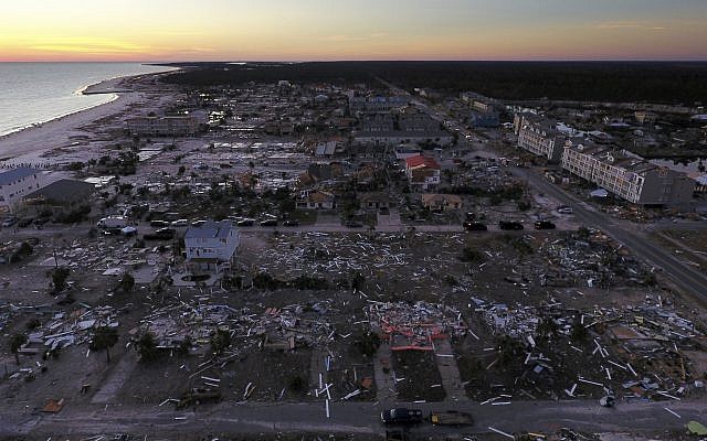 Damaged homes are seen along the water's edge in the aftermath of hurricane Michael in Mexico Beach, Florida, Oct. 12, 2018. (AP Photo/David Goldman)