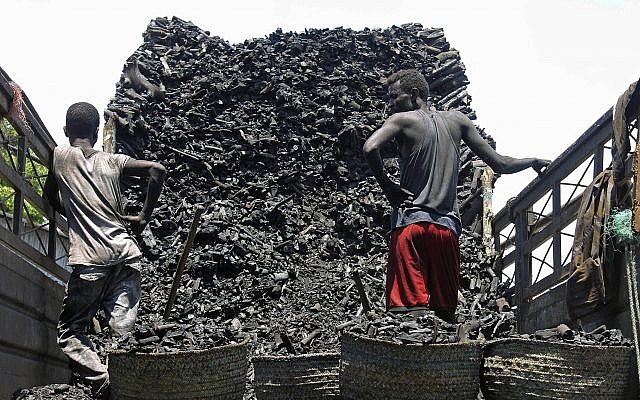 In this Tuesday Oct. 30, 2012 File photo, Somali porters offload charcoal from a truck at a charcoal market in Mogadishu, Somali (AP Photo/Farah Abdi Warsameh) In this Tuesday Oct. 30, 2012 File photo, Somali porters offload charcoal from a truck at a charcoal market in Mogadishu, Somali (AP Photo/Farah Abdi Warsameh)