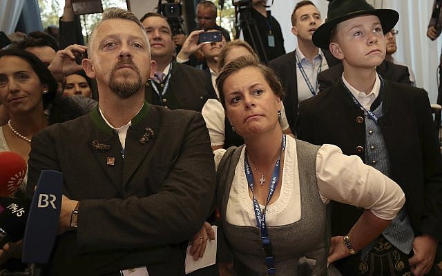 Supporters of the governing Christian Social Union, CSU, react after the first exit polls for the Bavarian state election in Munich, southern Germany, October 14, 2018. (Michel Kappeler/ dpa via AP) Supporters of the governing Christian Social Union, CSU, react after the first exit polls for the Bavarian state election in Munich, southern Germany, October 14, 2018. (Michel Kappeler/ dpa via AP)