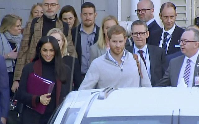 In this image made from video, Britain's Prince Harry, center right, and his wife Meghan Markle, left, Duke and Duchess of Sussex, approach a car at an airport in Sydney, October 15, 2018 (Australian Pool via AP) In this image made from video, Britain's Prince Harry, center right, and his wife Meghan Markle, left, Duke and Duchess of Sussex, approach a car at an airport in Sydney, October 15, 2018 (Australian Pool via AP)