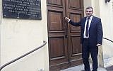 Albert Stankowski, director of the Warsaw Ghetto Museum, stands in front of the former hospital that will house the museum which is under creation and scheduled to open in 2023, in Warsaw, Poland, on Oct. 19, 2018 (AP Photo/Vanessa Gera)