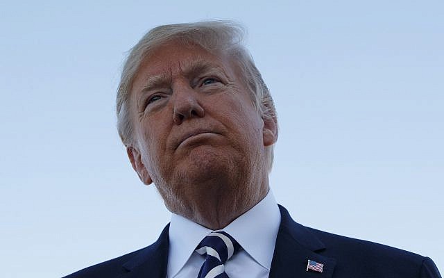 US President Donald Trump pauses as he speaks to media after a campaign rally before boarding Air Force One at Elko Regional Airport, Saturday, Oct. 20, 2018, in Elko, Nev., en route to Washington. (AP Photo/Carolyn Kaster) US President Donald Trump pauses as he speaks to media after a campaign rally before boarding Air Force One at Elko Regional Airport, Saturday, Oct. 20, 2018, in Elko, Nev., en route to Washington. (AP Photo/Carolyn Kaster)